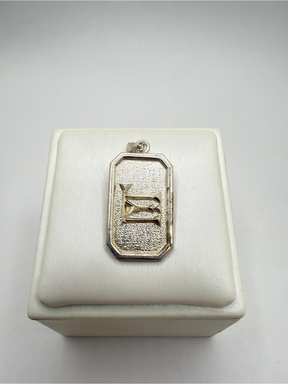 Stamped‎ 900 silver, unknown symbol, etched "Debra" pendant!